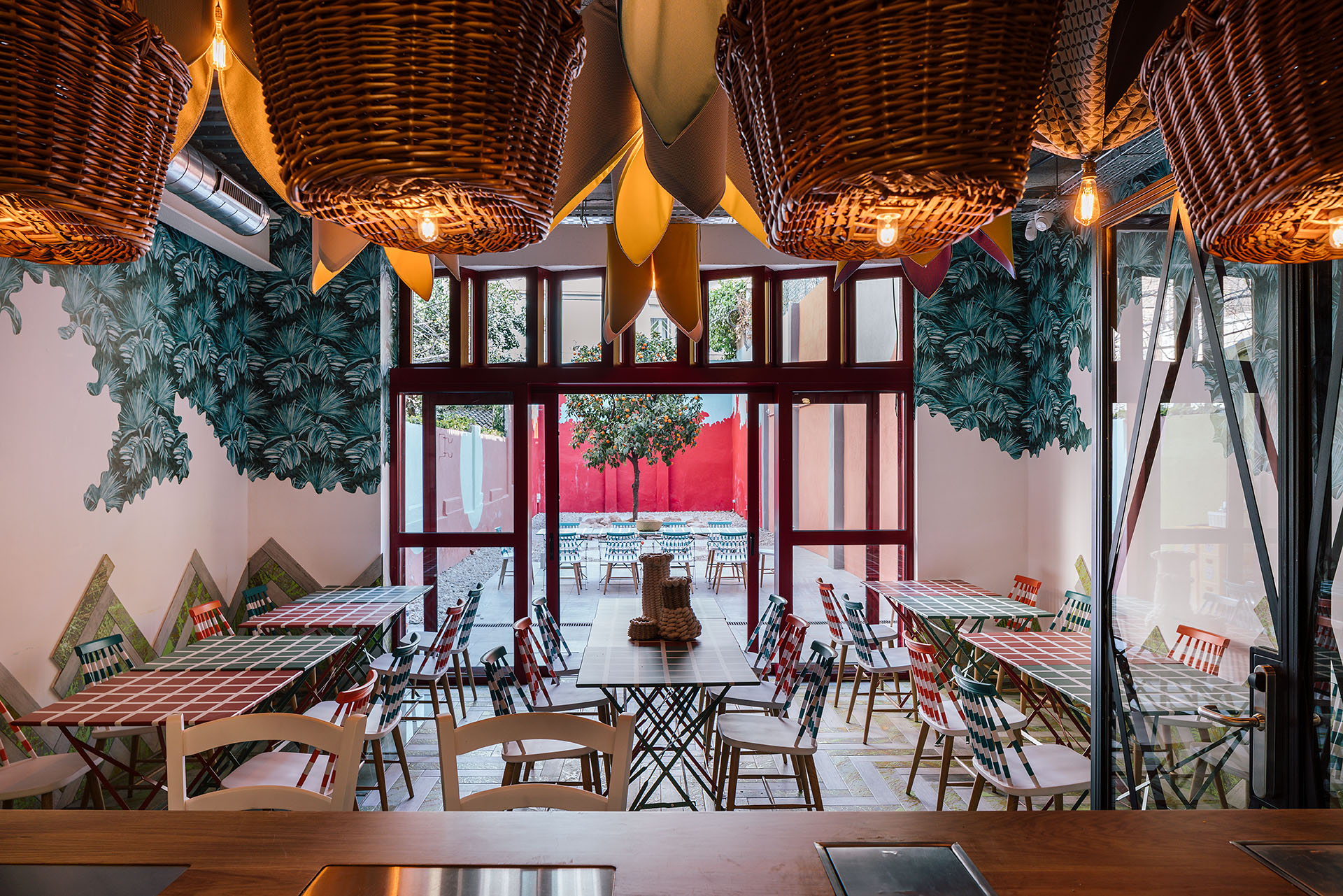 UtopicUs Clementina — courtyard with the clementine tree and restaurant interior